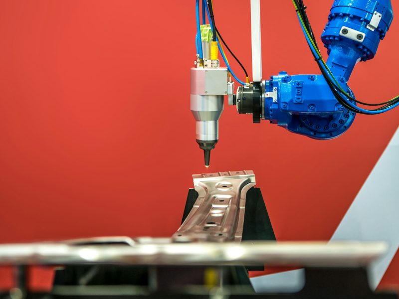 Industrial robotic welders weld the car body. Automobile production