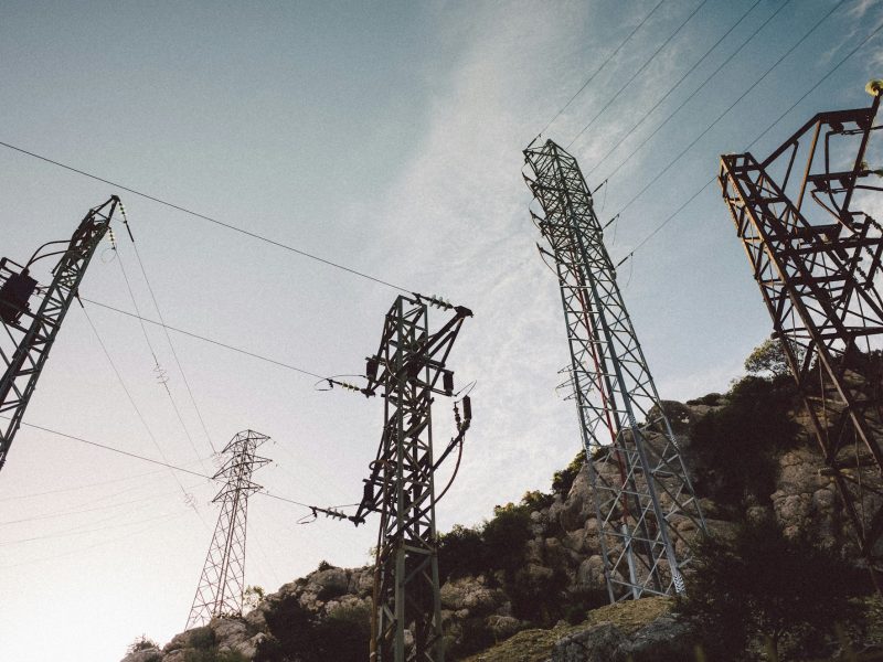Low angle shot of power line towers
