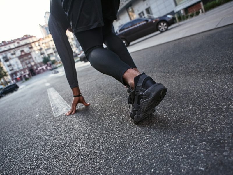 Ready to go Close-up photo of sportsman preparing for start in running position. Sport motivation