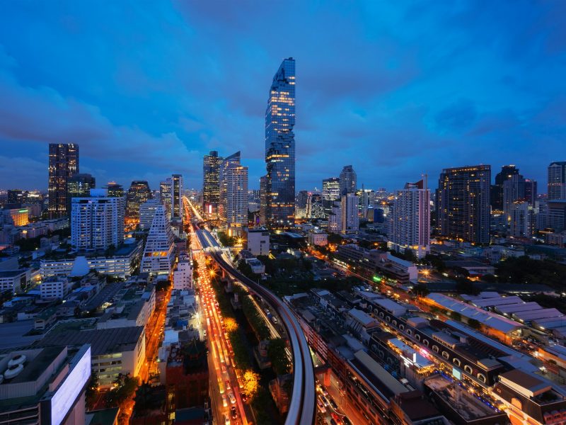 Smart city. Financial district and skyscraper buildings. Bangkok downtown area at night, Thailand.